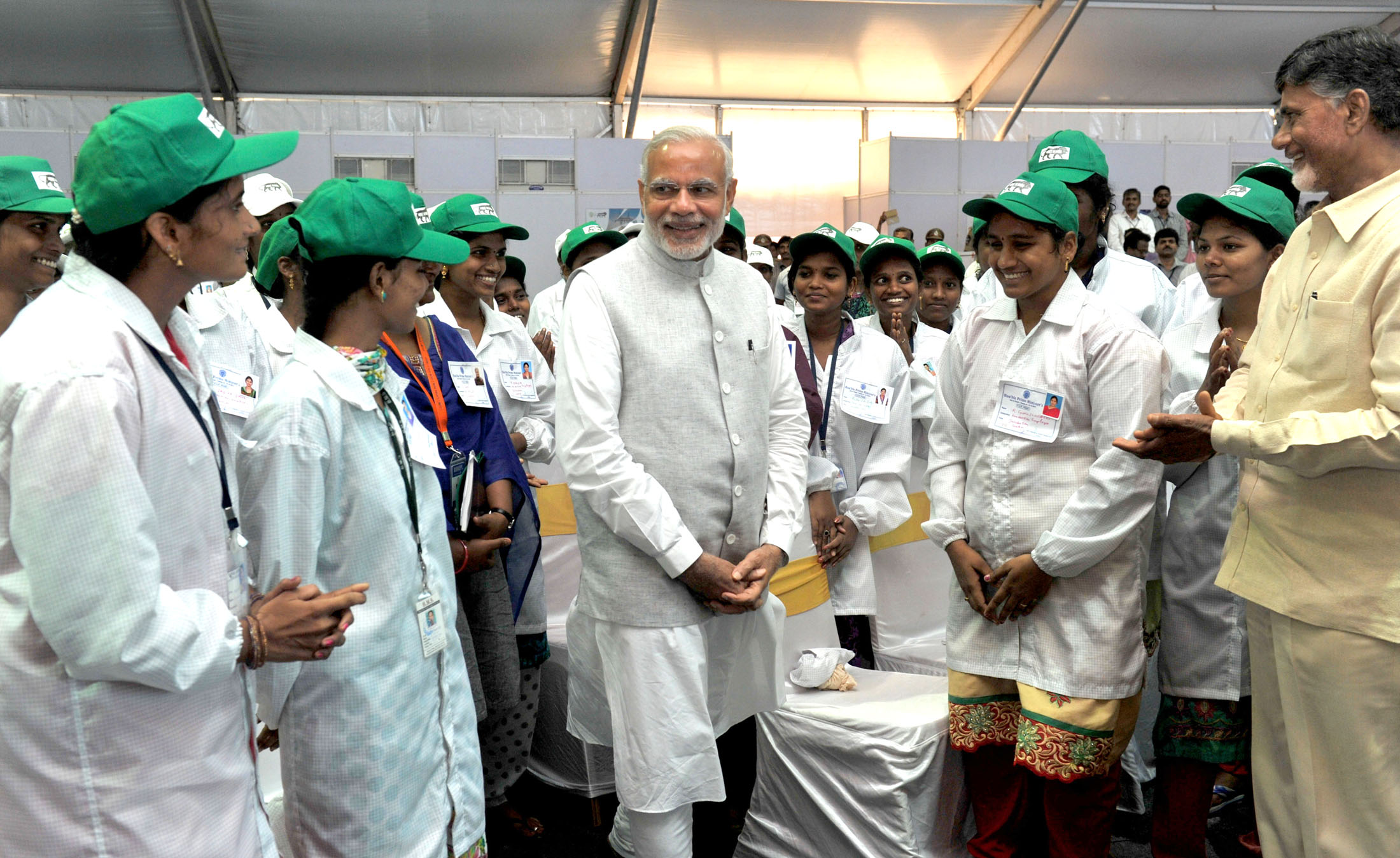 Indian electronics and high-tech manufacturing plant assembly line workers